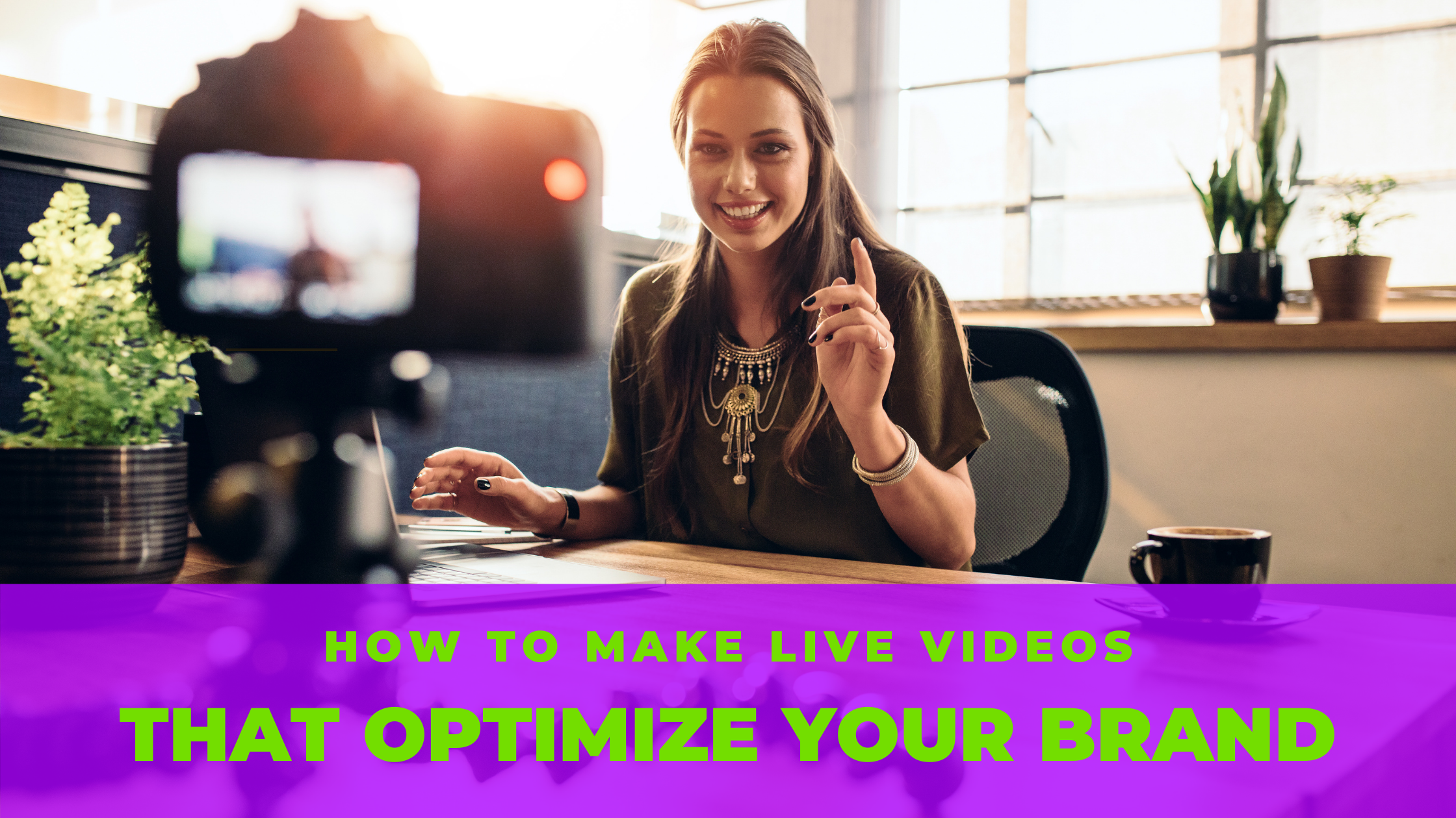 Young woman recording video for her vlog on a digital camera mounted on flexible tripod. Smiling woman sitting at her desk working on a laptop computer.